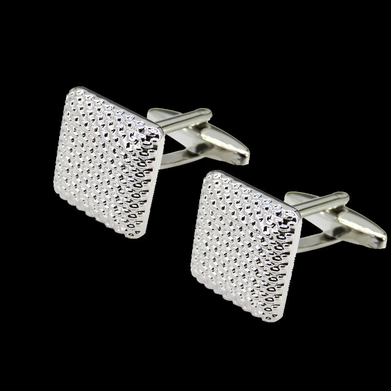 Silver square cufflink with a textured, diamond-cut surface and a simple bar design.
