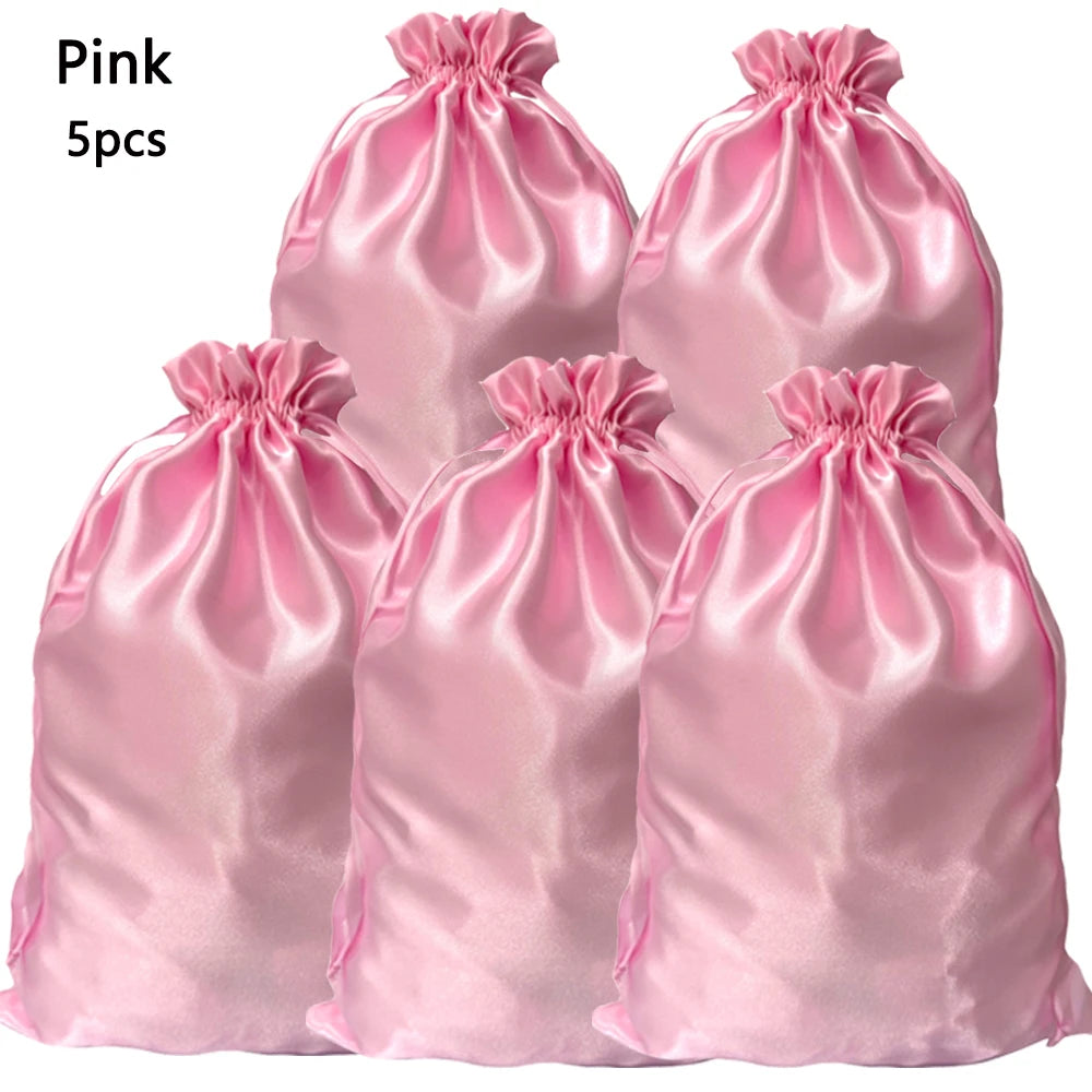 Five pink satin drawstring storage bags for hair tools