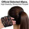Black elastic hair ties used to secure a ponytail on a woman's dark hair.