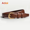 A brown leather belt with a gold buckle lying on a white surface.