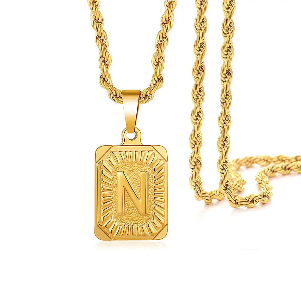 A gold-plated letter pendant necklace featuring the letter N on a thick gold chain.