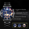 A black men's stainless steel quartz watch showing decorative grids and a calendar function.