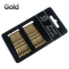 A set of 24 glitter wavy hair clips and bobby pins packaged in a black holder.