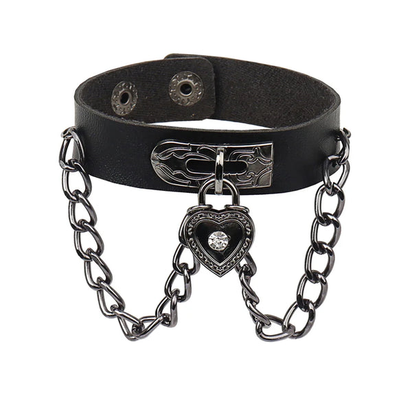 Black leather cuff bracelet set with a spiked metal charm and a heart pendant
