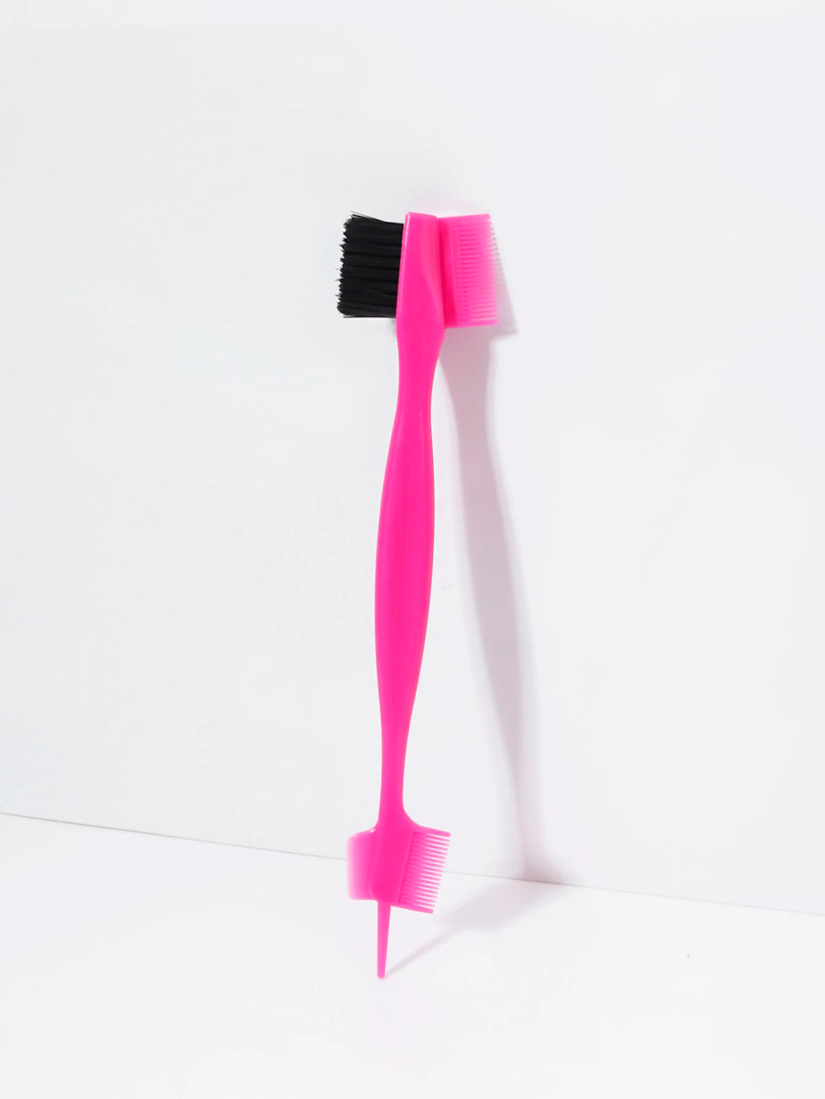 A bright pink precision edge control hair combing set with black bristles, shown against a white background.
