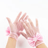 Pink bridal mesh finger gloves worn on a hand against a white background.