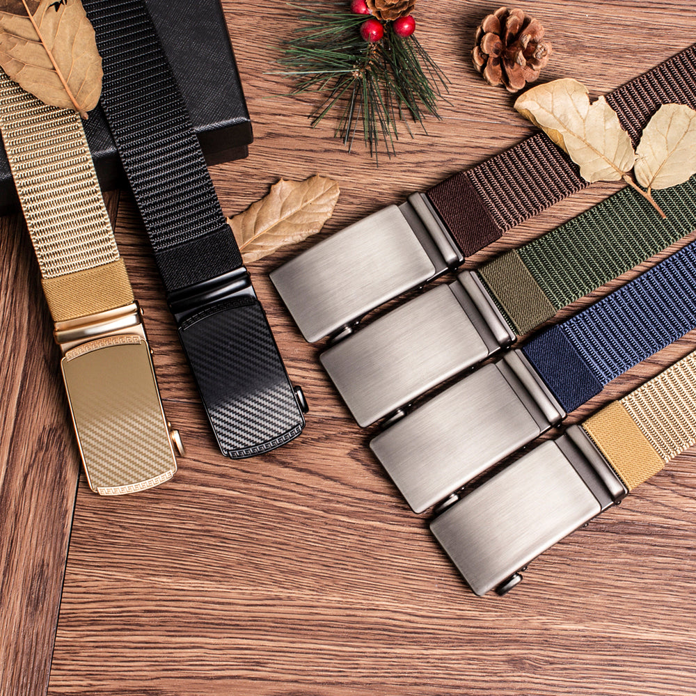 A close-up of a tactical canvas utility belt with various colored nylon straps and metal buckles on a wooden surface.