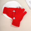 A bright red knit glove with gray accents resting on a white plate.