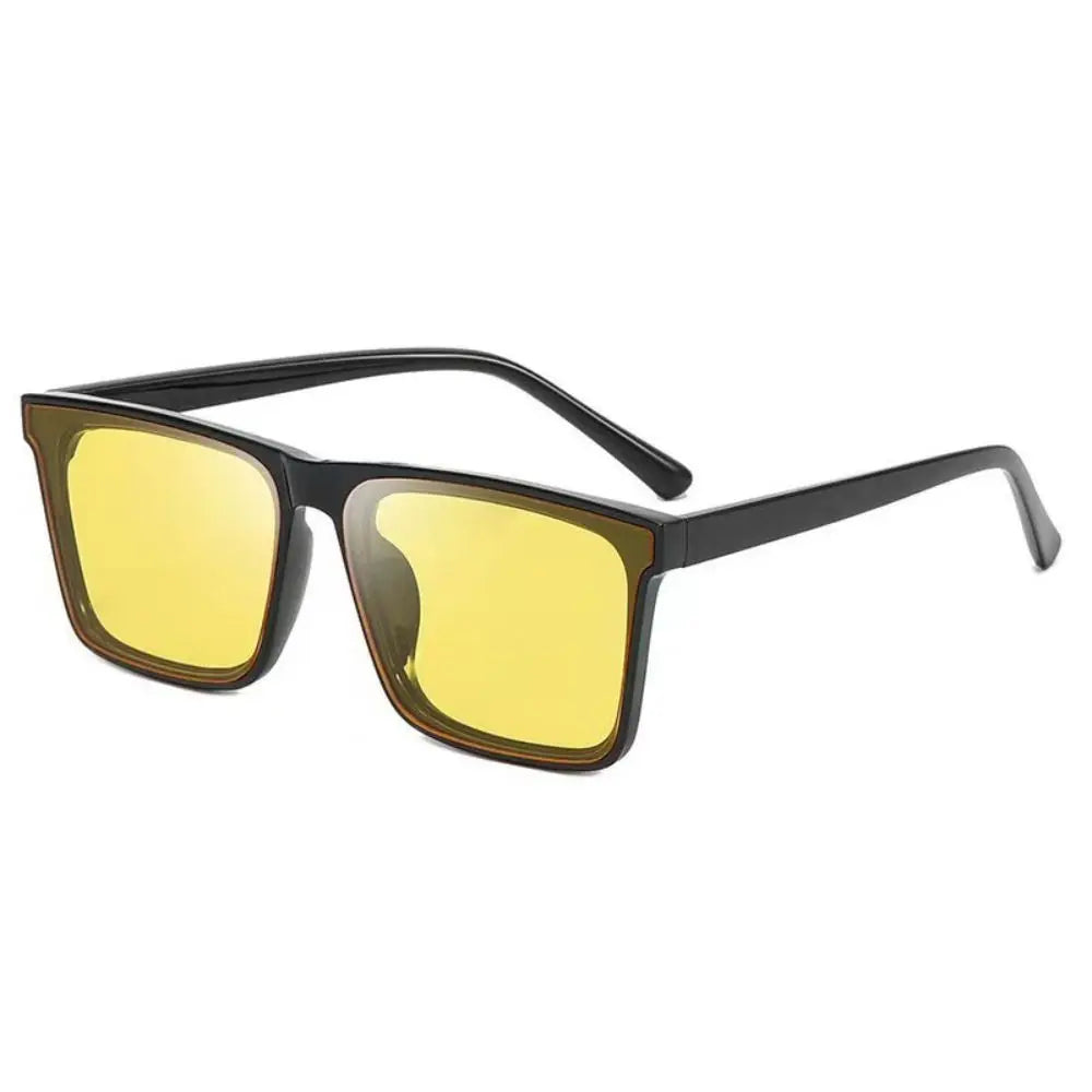 Yellow-tinted sunglasses with a black square frame shown against a white background.