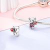 Sterling silver devil's eye charm bracelet featuring a teddy bear charm and a heart charm