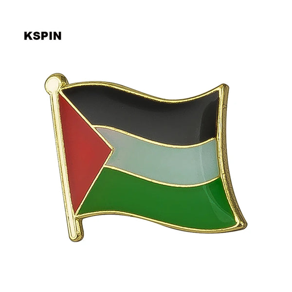 A lapel pin badge featuring a flag design with red, green, and black stripes on a gold-colored metal background.