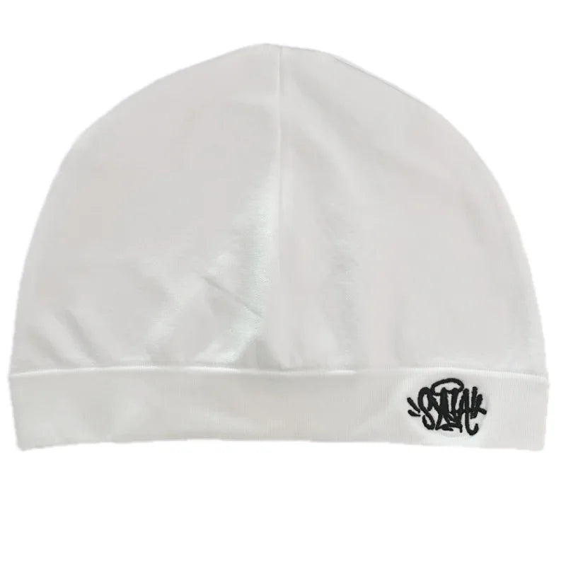 White beanie hat with black skull graphic