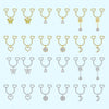 A collection of heart-shaped dangle non-piercing nipple rings with cubic zirconia in various gold tones.