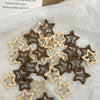 A collection of Y2K sweet star barrettes hair clips in brown and beige tones on white paper.