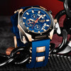 A blue and gold men's luxury quartz sport watch with a chronograph is displayed on a black strap.