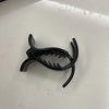 Black acrylic hair claw designed for ponytail styling