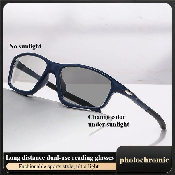 A pair of dark blue photochromic reading glasses resting on a white surface.