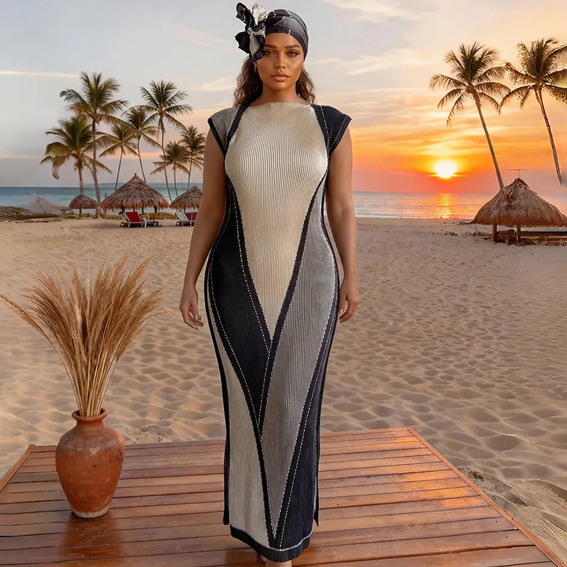 A plus size model wearing a black and cream African silk printed two-piece set standing on a wooden deck with a tropical suns