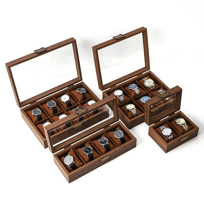 A wooden display box with multiple slots for showcasing watches and jewelry.