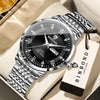 A silver and black Binbond quartz wristwatch with a metal bracelet is displayed on a light-colored box.