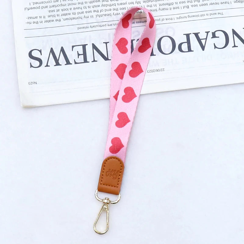 Pink gemustertes Leder-Handy-Lanyard mit goldfarbener Clips