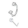 A set of silver horseshoe nose rings, including a hoop and a stud, with clear diamond-cut stones.