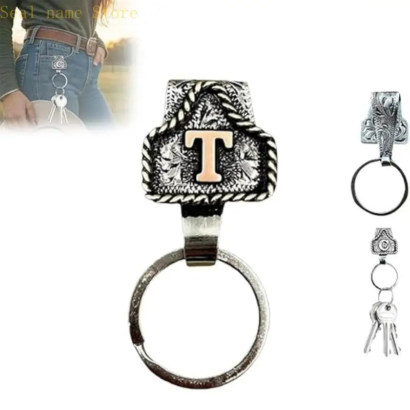Silver textured letter T ring and keychain on a leather strap
