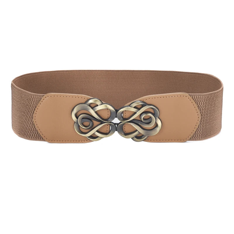 A tan vintage leather elastic belt featuring an ornate brass twisted buckle.