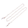 A delicate silver chain lanyard featuring small star charms for eyeglasses.