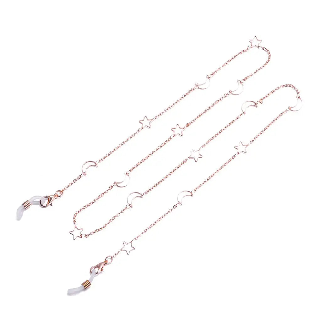 A delicate silver chain lanyard featuring small star charms for eyeglasses.