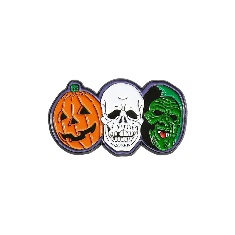 Emaille-Pin-Sammlung mit drei Halloween-Designs: Kürbis, Schädel und Monsterkopf.