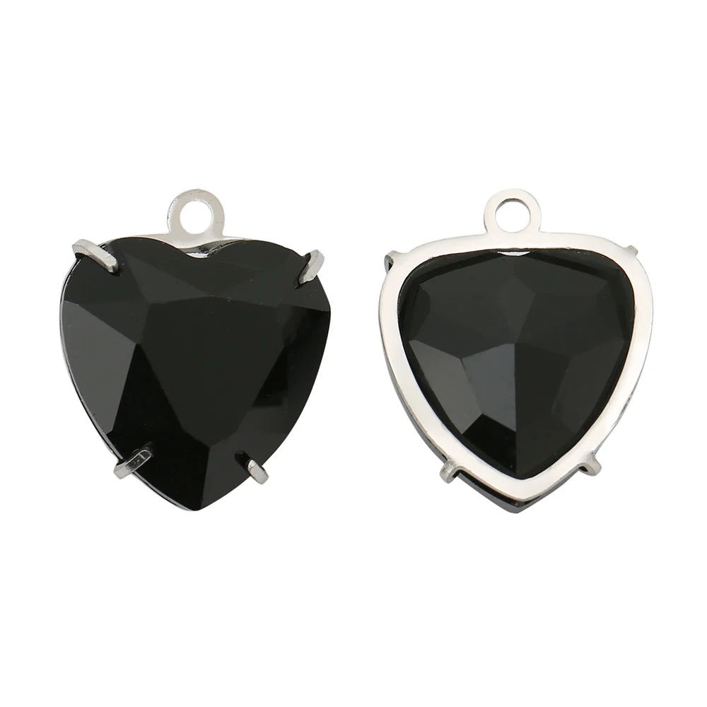 A pair of black heart-shaped crystal pendants made of PVD stainless steel.