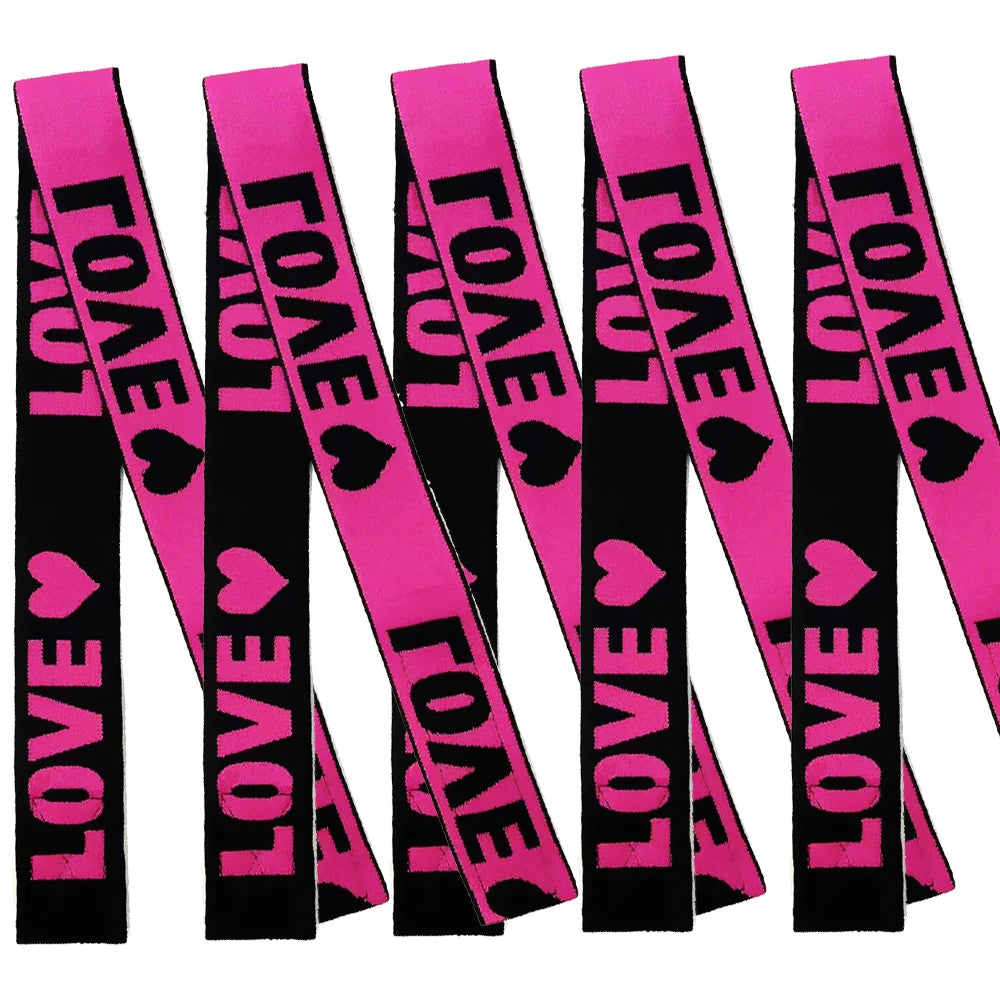 Pack of black elastic bands with pink lettering for wig edges