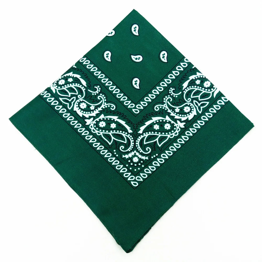 A dark green paisley bandana featuring white embroidery and geometric patterns.