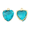 A pair of heart-shaped crystal pendants with a vibrant blue-green color set in gold-toned stainless steel.