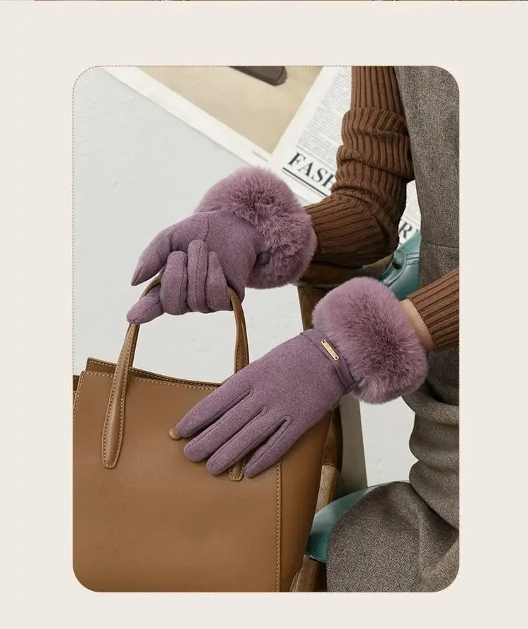A close-up of a hand wearing a plush, purple wrist glove resting on a tan leather handbag.