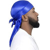 A man wearing a blue silky durag shower cap bandana and a white shirt.