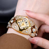A close-up of a luxury diamond inlaid quartz wristwatch with a gold casing and sparkling stones on a person's wrist.