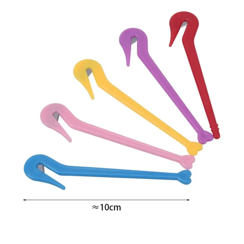 A set of colorful hair elastic and rubber band remover tools with pink, purple, yellow, and red handles.