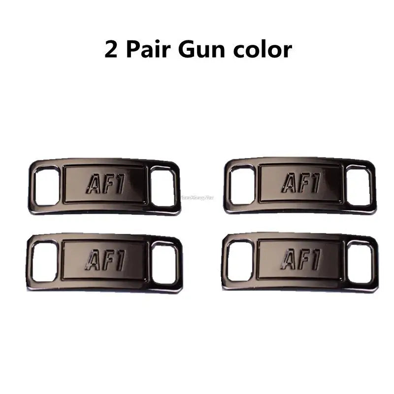 Two pairs of gun color diamond shoe charms and laces