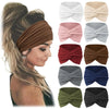 A collection of bohemian pattern headbands in various colors and shades shown folded for yoga and sports.