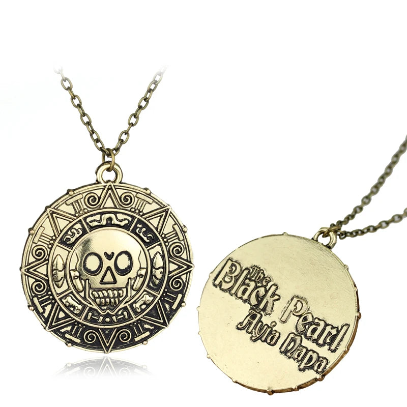 Gold skull pendant necklace with intricate design and a circular gold pendant.