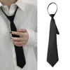 A black clip-on tie is shown against a white shirt, displayed both on a person and separately.