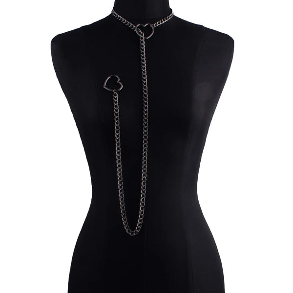 A black slip chain necklace with a heart pendant displayed on a black mannequin.