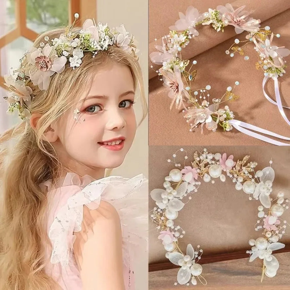 A young girl wearing an elegant floral wreath headband with light pink and white flowers.