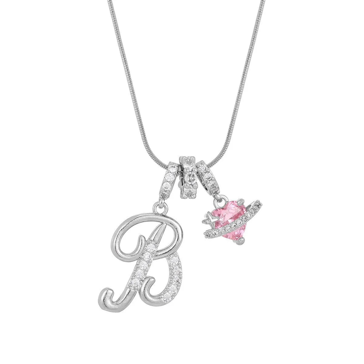 Silver letter pendant necklace featuring a diamond-encrusted initial and a pink gemstone charm