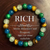 A circular bracelet made of tiger's eye stone and malachite beads in various shades of green, blue, and gold.