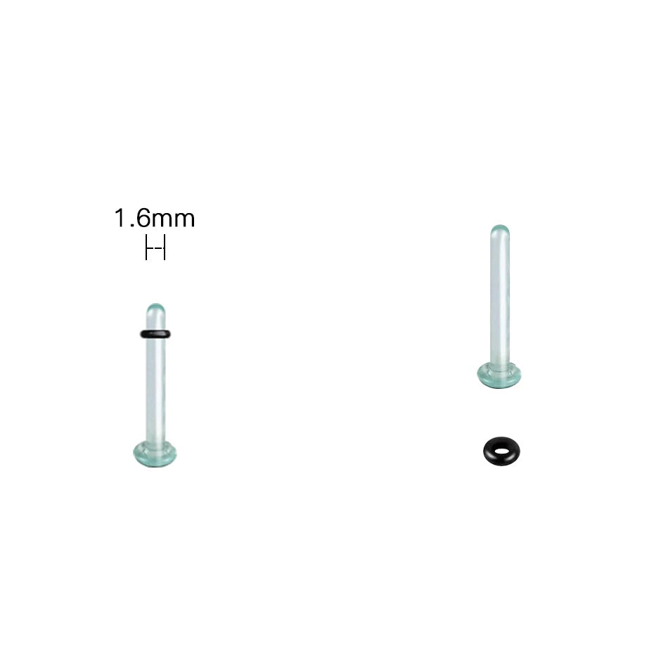 A glass ear stretching kit showing a clear tube and a round plug component.