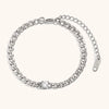 Silver chain bracelet featuring a round water drop zircon charm.
