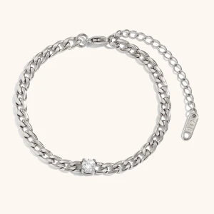 Silver chain bracelet featuring a round water drop zircon charm.